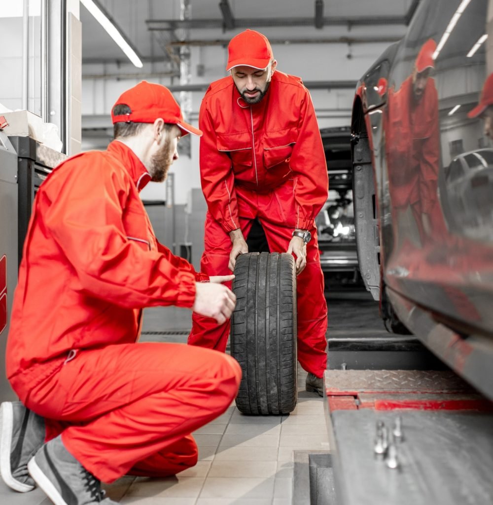 workers-changing-wheels-at-the-car-service-1.jpg